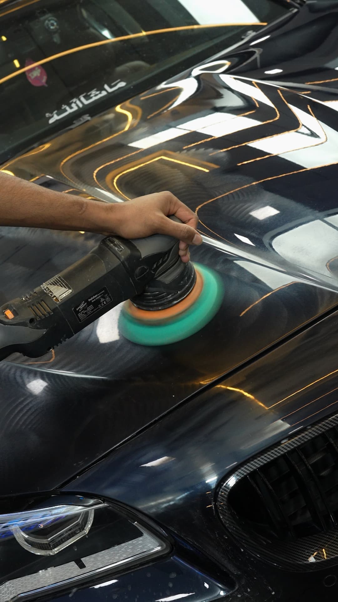 Machine paint correction under inspection lighting at Carsuit studio Mumbai
